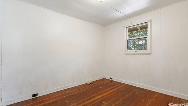 empty room with dark wood-type flooring