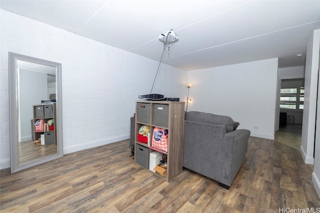 sitting room featuring dark wood-type flooring