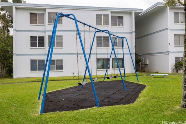 view of play area featuring a patio and a lawn