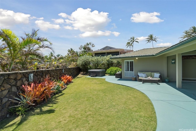 view of yard with fence, a hot tub, a patio area, and outdoor lounge area