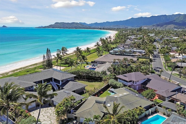 bird's eye view with a beach view, a residential view, and a water and mountain view