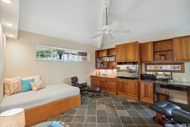 bedroom featuring built in desk, vaulted ceiling, and ceiling fan