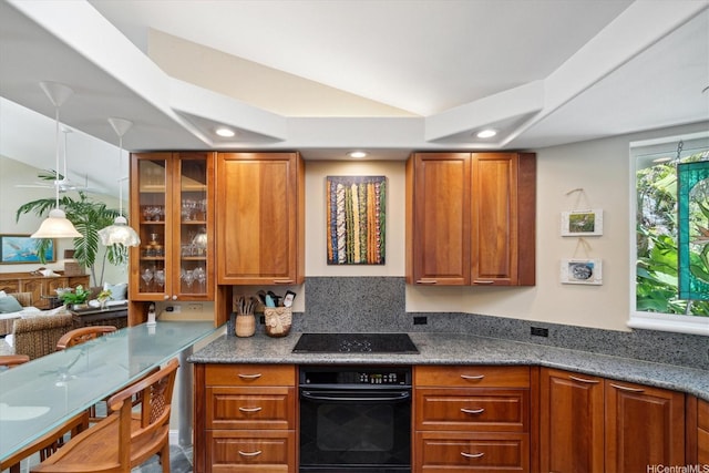 kitchen with recessed lighting, black appliances, brown cabinets, and glass insert cabinets