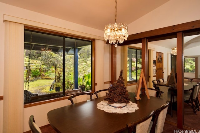 dining space with an inviting chandelier, lofted ceiling, and a healthy amount of sunlight