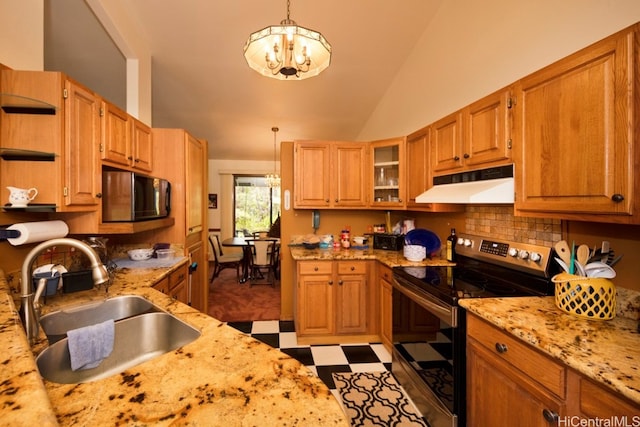 kitchen featuring appliances with stainless steel finishes, an inviting chandelier, decorative light fixtures, and sink