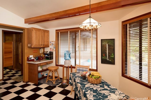 dining space featuring an inviting chandelier and lofted ceiling with beams