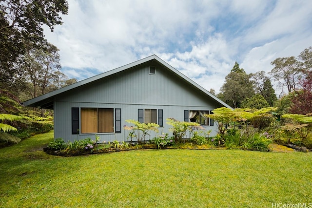 view of home's exterior featuring a yard