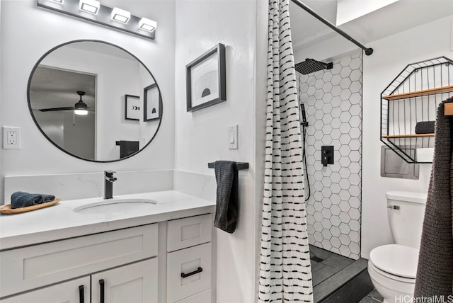 bathroom with toilet, curtained shower, vanity, and ceiling fan