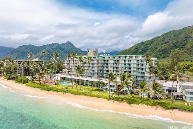 exterior space featuring a beach view and a water and mountain view