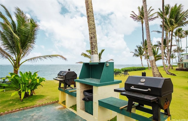 53-567 Kamehameha Hwy Unit 311, Hauula, HI 96717 - view of patio featuring a water view and a grill