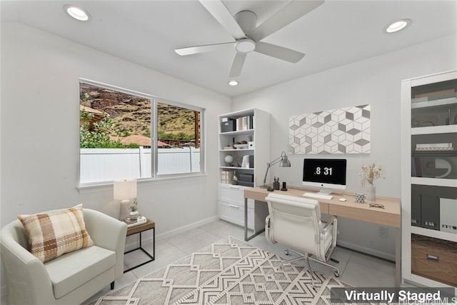 tiled home office featuring ceiling fan