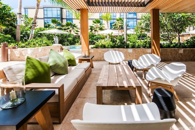 view of patio featuring pool water feature and an outdoor hangout area