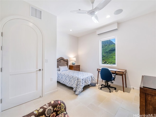 bedroom featuring ceiling fan and a wall unit AC