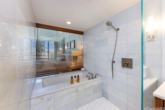 bathroom featuring vanity, tile walls, and separate shower and tub