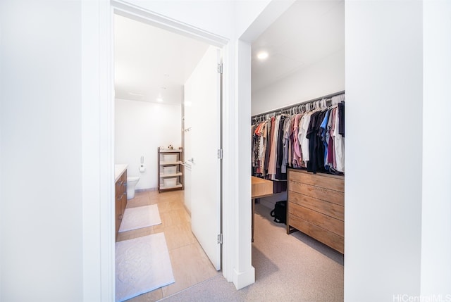 spacious closet with light tile patterned flooring