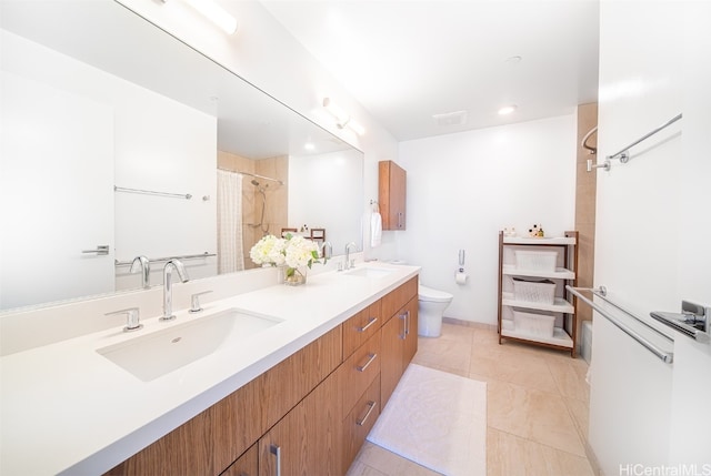 bathroom with toilet, curtained shower, vanity, and tile patterned flooring