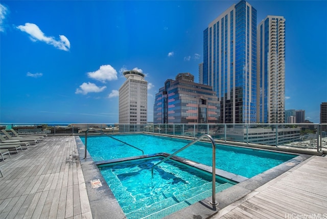 view of pool featuring a hot tub