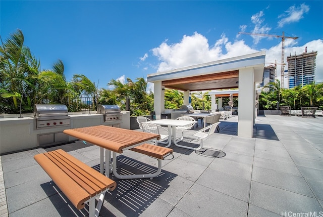 view of patio with a grill and an outdoor kitchen