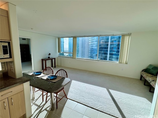 interior space featuring light colored carpet