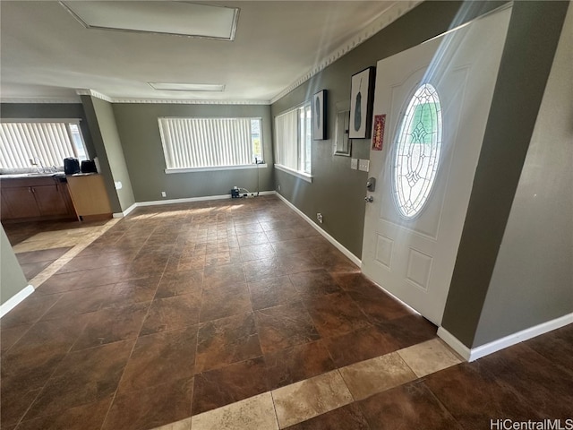 foyer entrance with ornamental molding