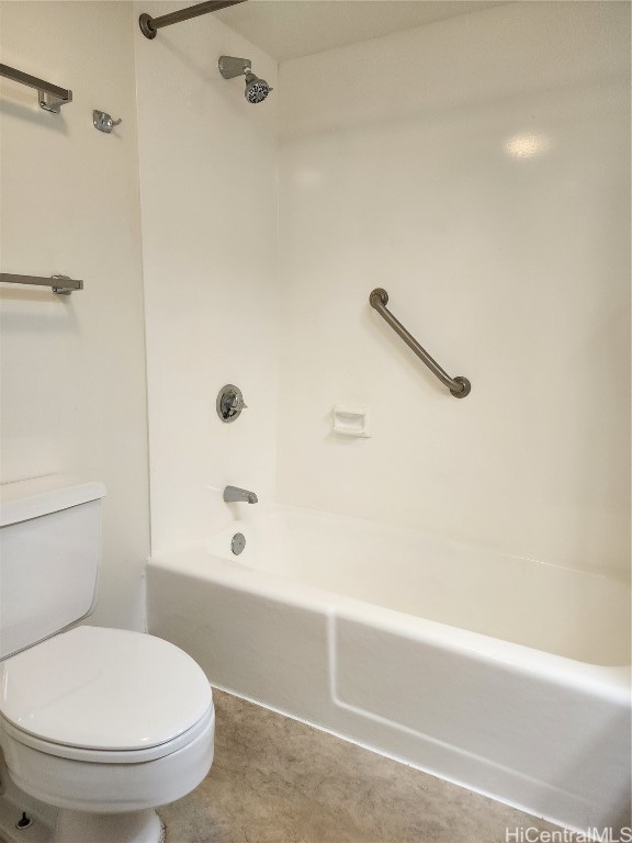 bathroom featuring toilet and shower / bathing tub combination