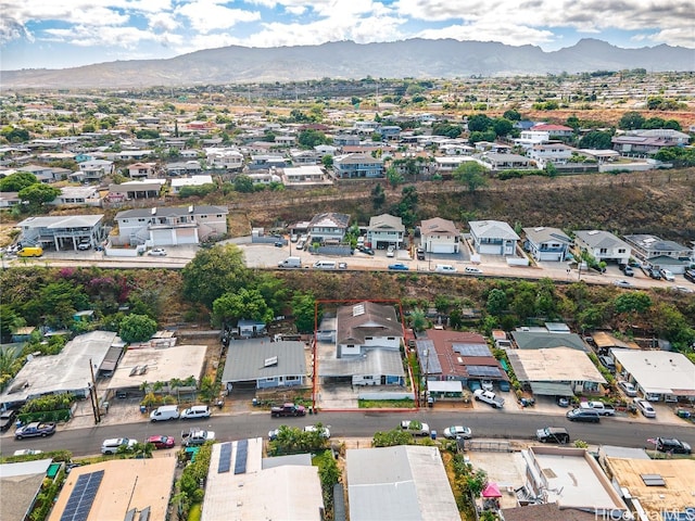 birds eye view of property with a mountain view