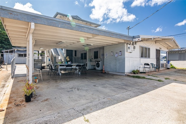 exterior space featuring a patio and washer / clothes dryer