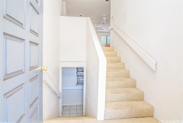 stairway with ceiling fan