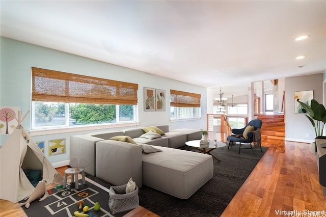 living room featuring hardwood / wood-style floors and a chandelier