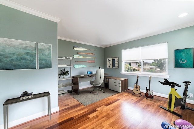 home office featuring crown molding and hardwood / wood-style flooring