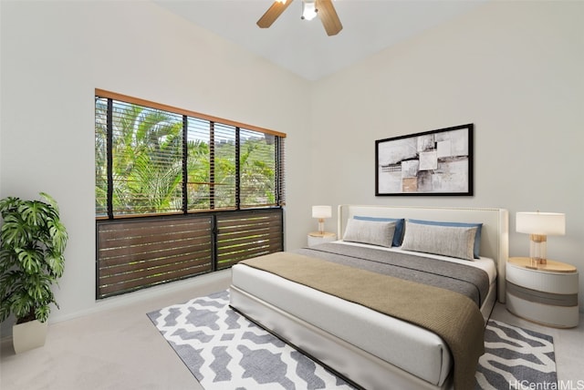 bedroom featuring ceiling fan and light colored carpet