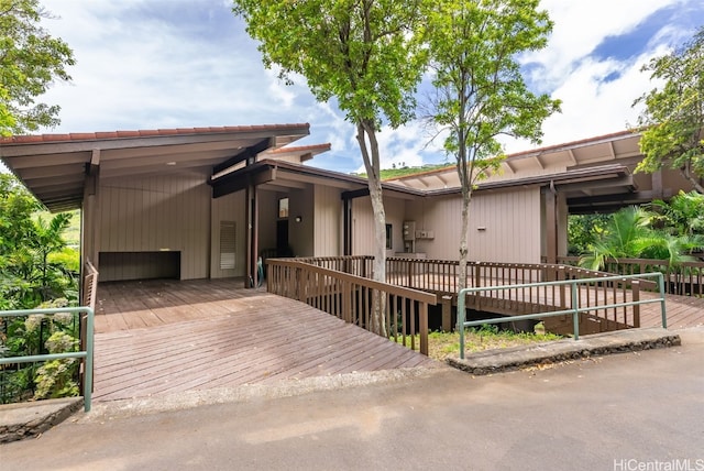 view of front of home featuring a wooden deck