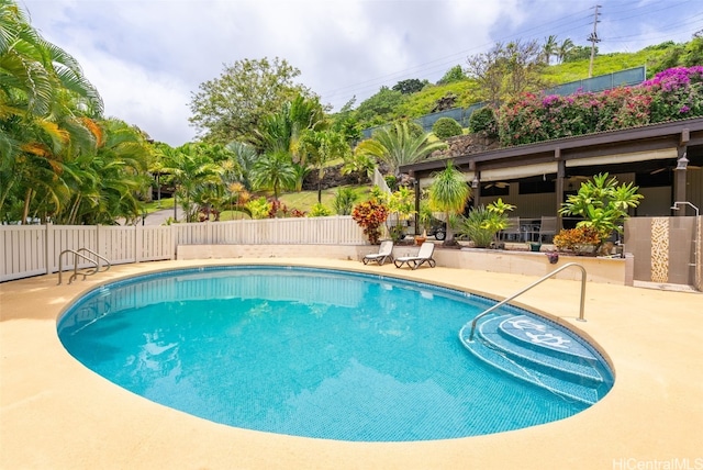 view of swimming pool featuring a patio