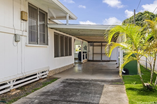 view of home's exterior featuring a carport