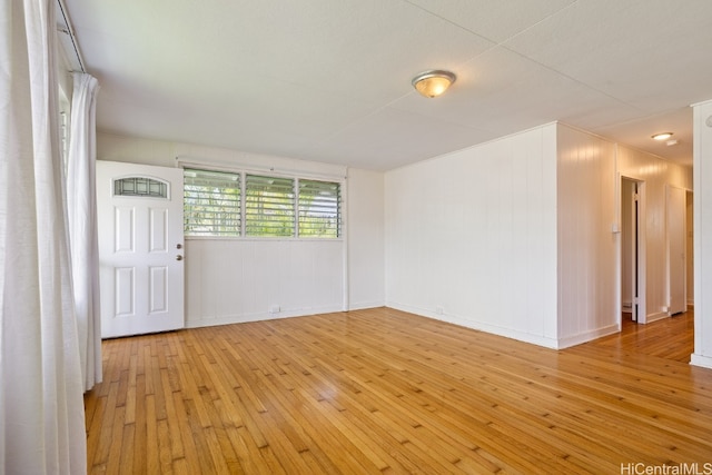 spare room with light wood-type flooring