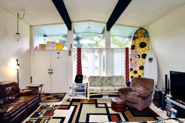 living room featuring vaulted ceiling with beams and a textured ceiling