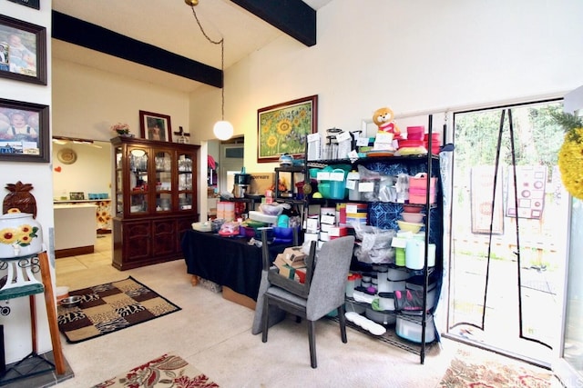 carpeted home office with beamed ceiling