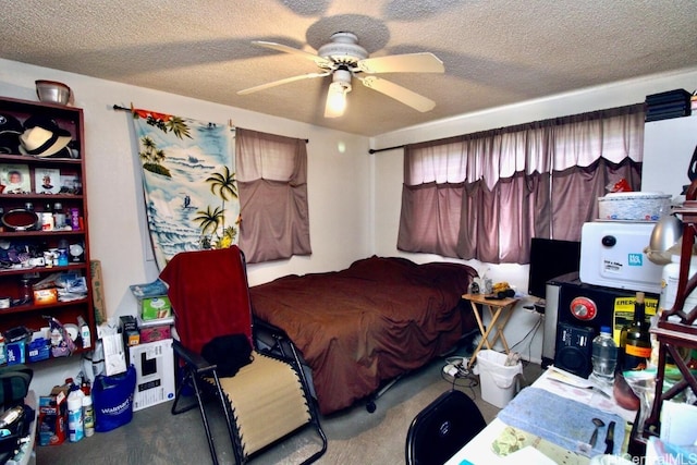 carpeted bedroom featuring ceiling fan and a textured ceiling