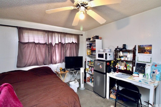 carpeted bedroom with ceiling fan and a textured ceiling