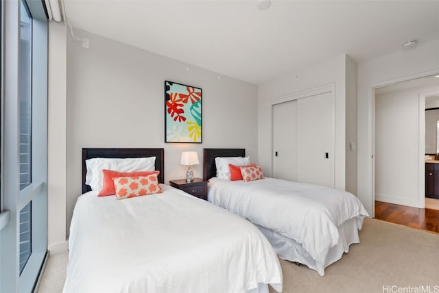 bedroom featuring light hardwood / wood-style floors and a closet