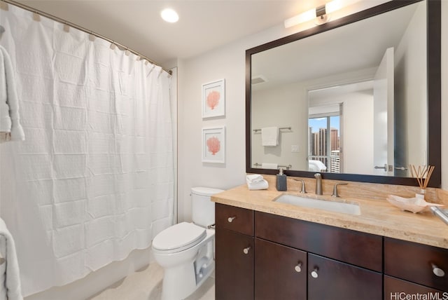 bathroom featuring vanity, a shower with curtain, and toilet