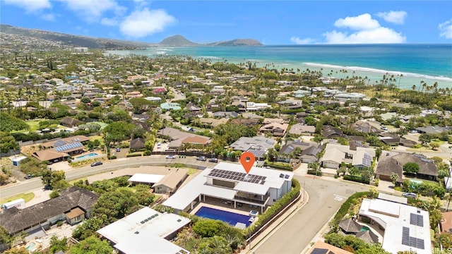 birds eye view of property with a water and mountain view