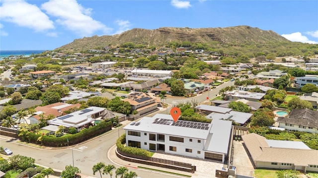 birds eye view of property with a mountain view