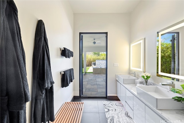 bathroom featuring a wealth of natural light, vanity, tile patterned flooring, and ceiling fan