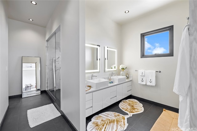 bathroom featuring vanity, tile patterned floors, and an enclosed shower