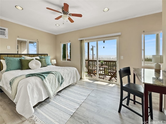 bedroom featuring multiple windows, access to exterior, and ceiling fan