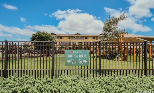 view of gate featuring a yard