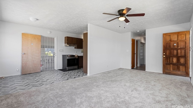 unfurnished living room with a textured ceiling, light colored carpet, and ceiling fan