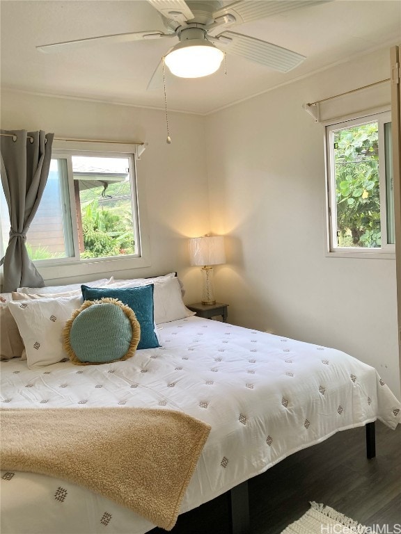 bedroom featuring ceiling fan and hardwood / wood-style floors