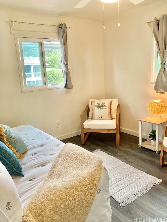 bedroom featuring dark hardwood / wood-style floors and ceiling fan